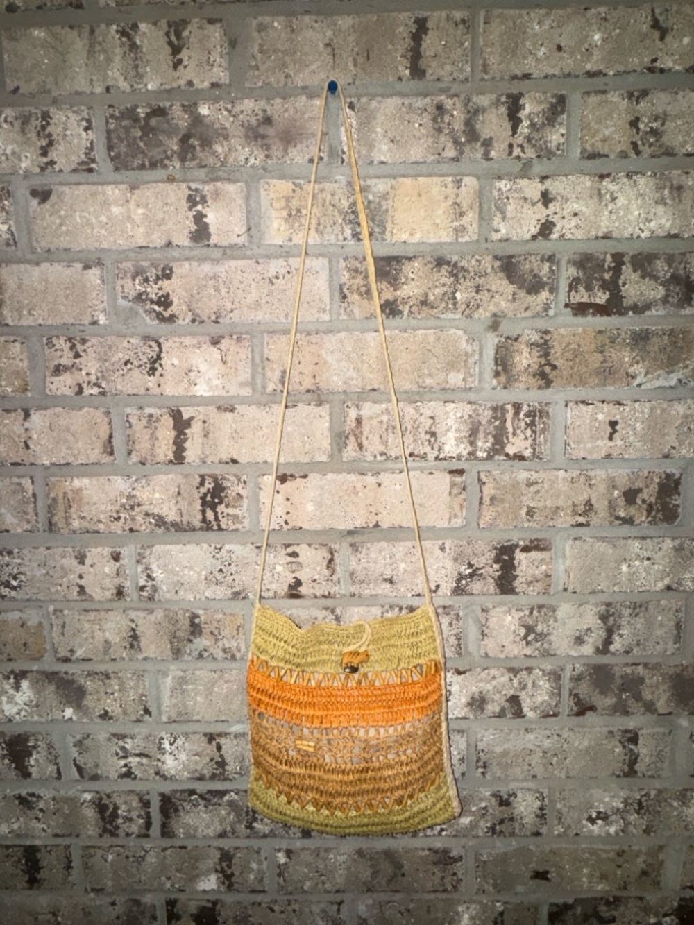 Scala Collection woven straw crossbody tote bag with animal toggle closure